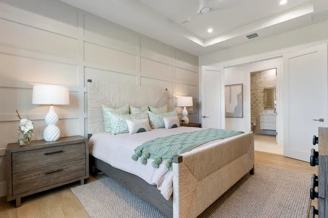 a bedroom with a bed and night stand