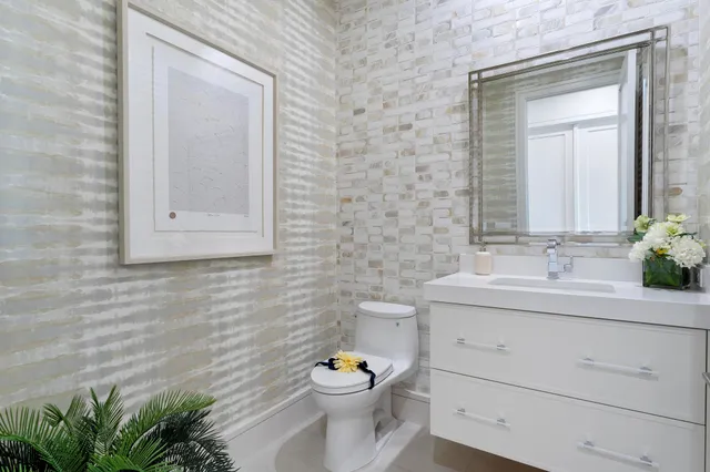 a bathroom with a toilet and a shower curtain
