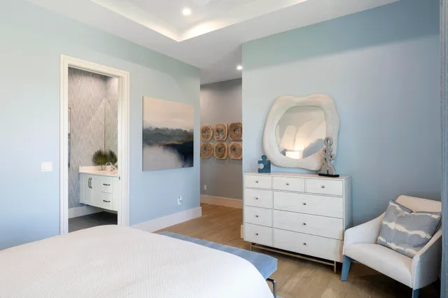 a view of a kitchen sink and dishwasher with wooden floor