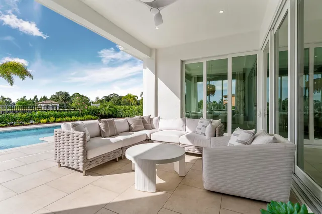 a view of house with backyard and porch