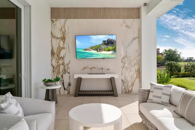 swimming pool view with a seating space