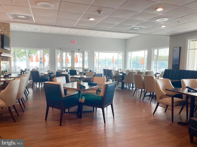 a view of a swimming pool with a patio and a garden