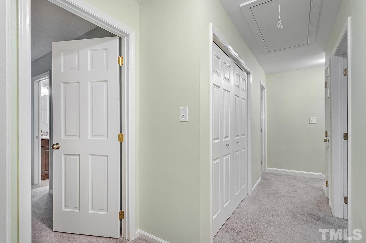 7416 Old Fox Trail Raleigh, NC 27613 - Photo 20 of 26 wooden floor with white doors