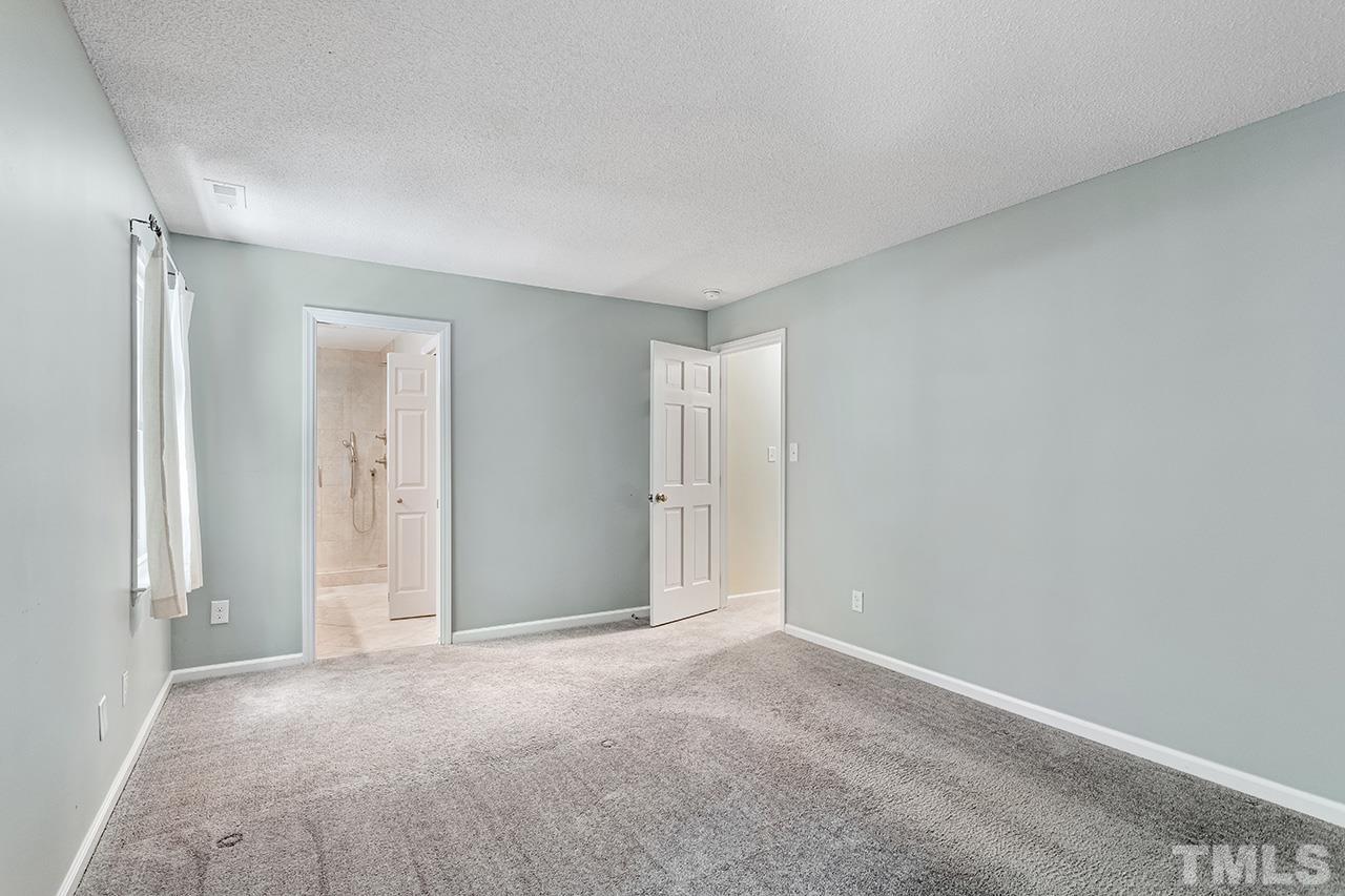 7416 Old Fox Trail Raleigh, NC 27613 - Photo 24 of 26 a view of an empty room and a window