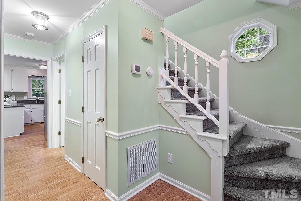 7416 Old Fox Trail Raleigh, NC 27613 - Photo 8 of 26 a view of entryway and hall with wooden floor