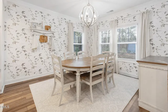 a kitchen with stainless steel appliances granite countertop a sink stove and microwave