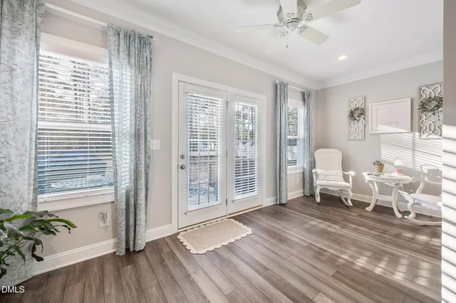 a view of a dining room with furniture and window