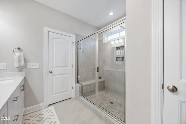 a bedroom with a bed and a cabinet