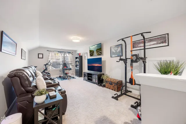 a bathroom with a sink a toilet and shower curtain