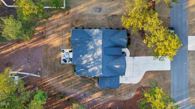 a view of a house with a yard covered in snow