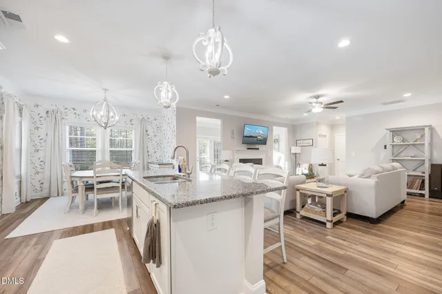 a view of a livingroom with furniture and hardwood floor