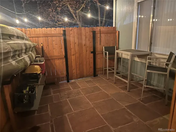 a bathroom with a glass door shower and a mirror