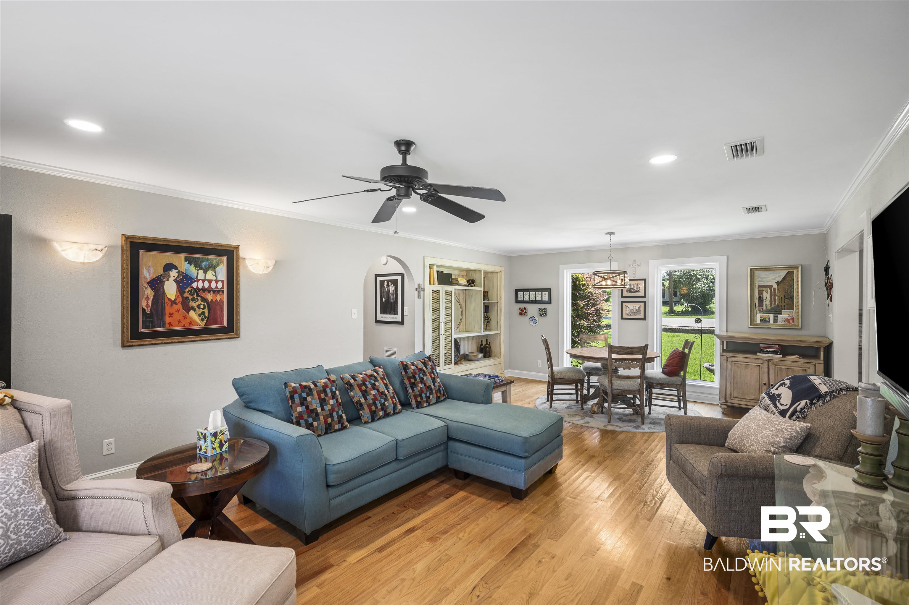 1615 5th Street Daphne, AL 36526 - Photo 10 of 28 Open-concept living area featuring wood-finish flooring, recessed lighting, and crown molding