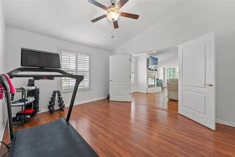 a view of a livingroom with hardwood floor and a ceiling fan