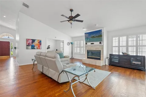a living room with furniture and a fireplace