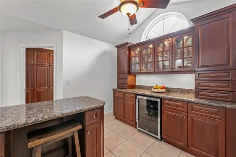 a kitchen with stainless steel appliances granite countertop a stove and a sink