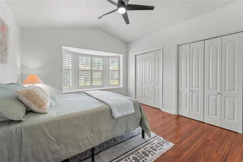 a bedroom with a bed and window