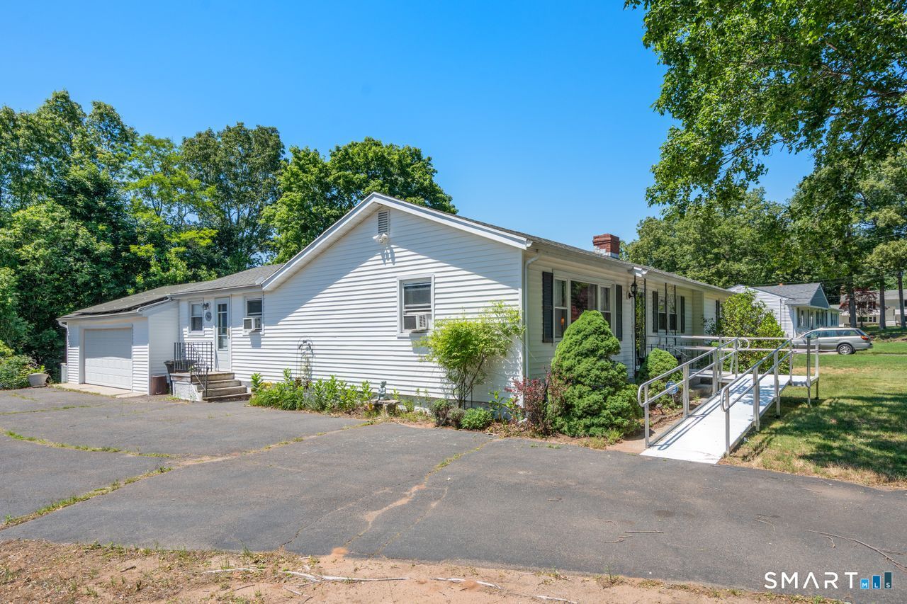 9 Stanton Road North Haven, CT 06473 - Photo 32 of 35 a view of a house with a yard and potted plants