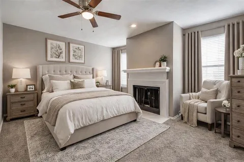 a bed room with a bed and a fireplace