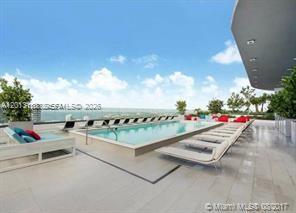 45 Southwest 9th Street, Unit 1907 Miami, FL 33130 - Photo 16 of 16 a view of roof deck with couch and potted plants