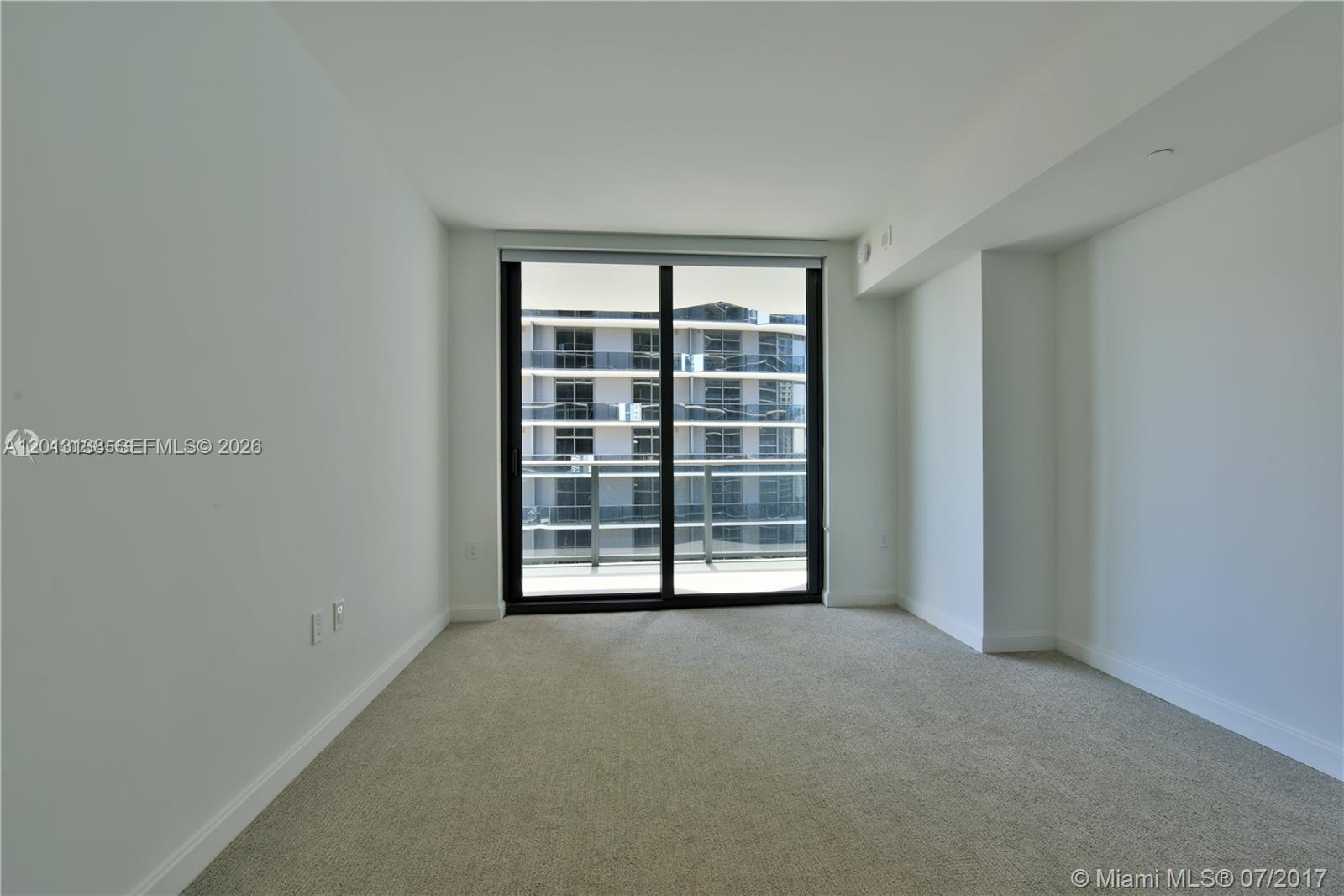 45 Southwest 9th Street, Unit 1907 Miami, FL 33130 - Photo 5 of 16 a view of a room with a large window