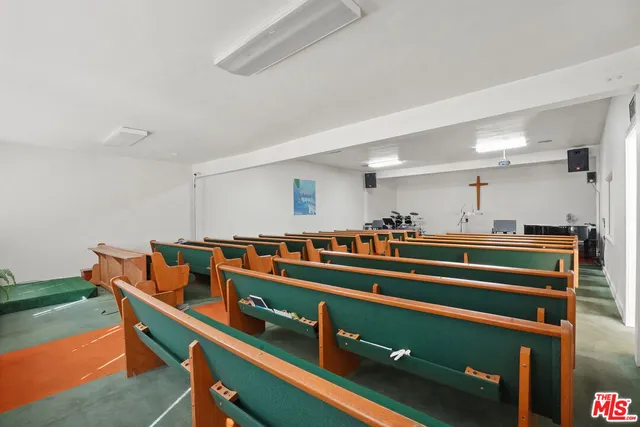 a very nice looking room with a chair and a fireplace