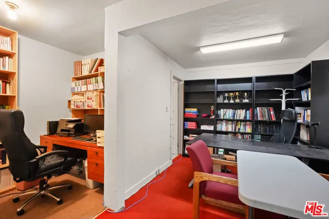 a view of a livingroom with furniture and a window