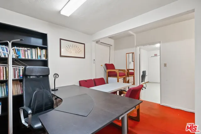 a view of a dining area with furniture and a chandelier