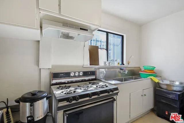 a view of a livingroom with furniture and an empty room