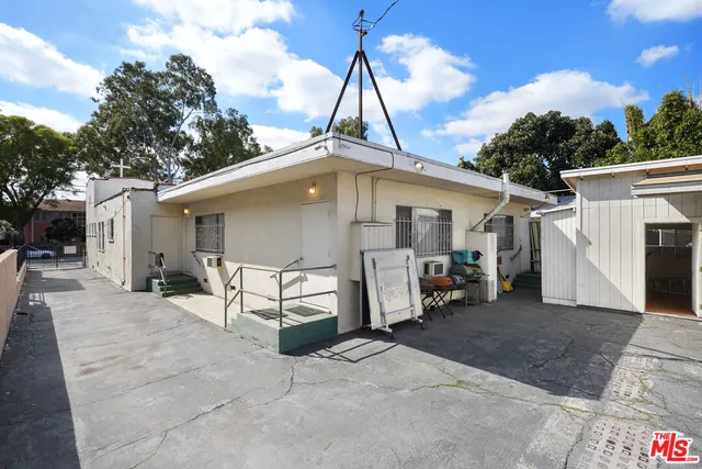 an aerial view of a house with a backyard