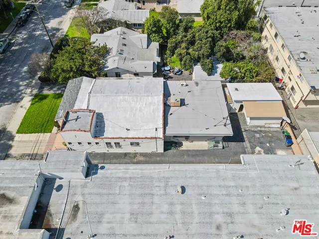 an aerial view of residential building and trees