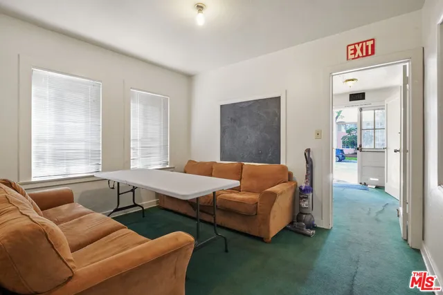 a room with lots of tables and chairs