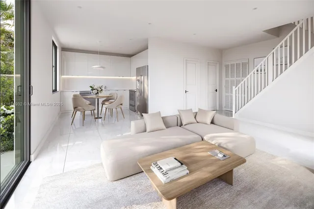 a living room with furniture and a dining table with garden view