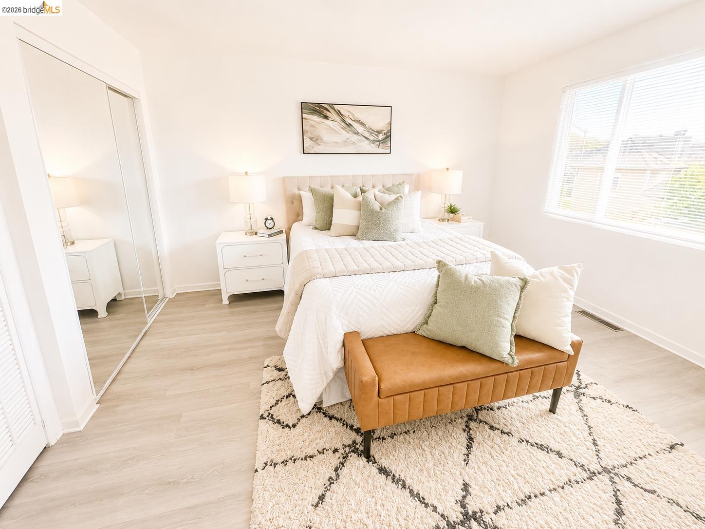 810 Pierce Street Albany, CA 94706 - Photo 5 of 25 Spacious room featuring light wood-finish flooring, a large window with blinds, and white walls
