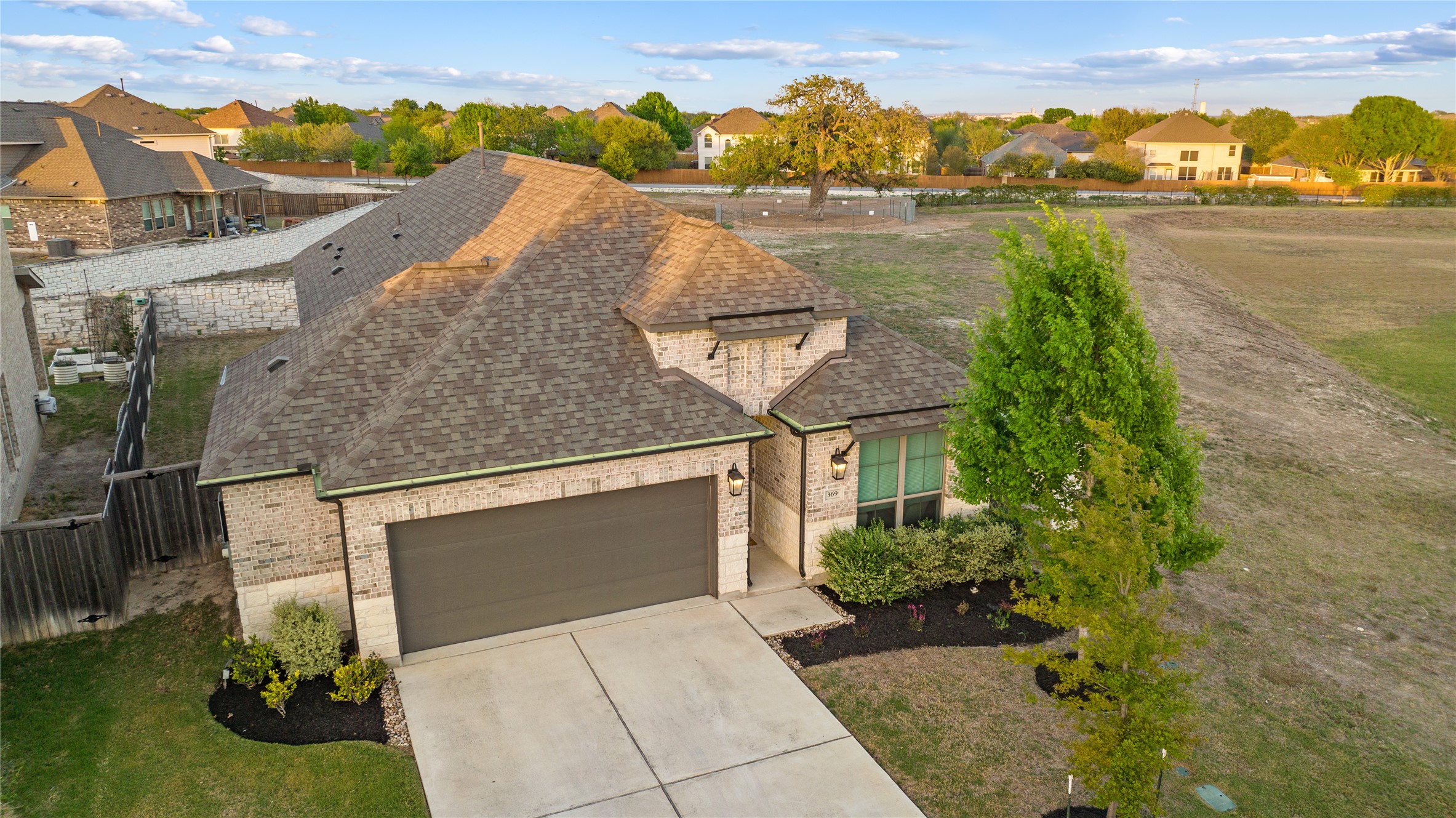 369 Cold Riv Run Kyle, TX 78640 - Photo 2 of 40 View of front of house featuring a 2-car attached garage.