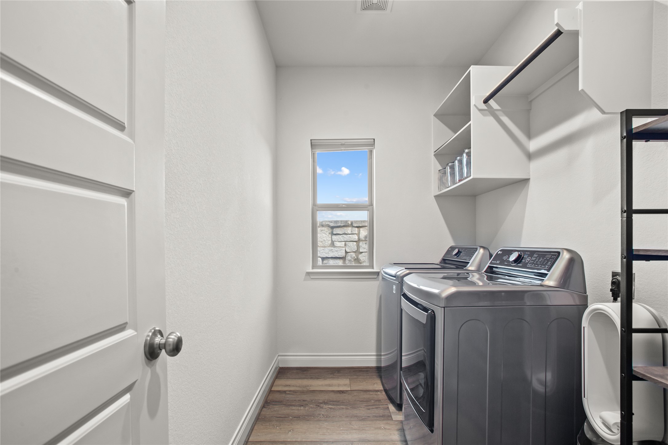 369 Cold Riv Run Kyle, TX 78640 - Photo 25 of 40 The laundry room has plenty of room for the washer and dryer, plus storage space for an additional fridge or clothes folding table.