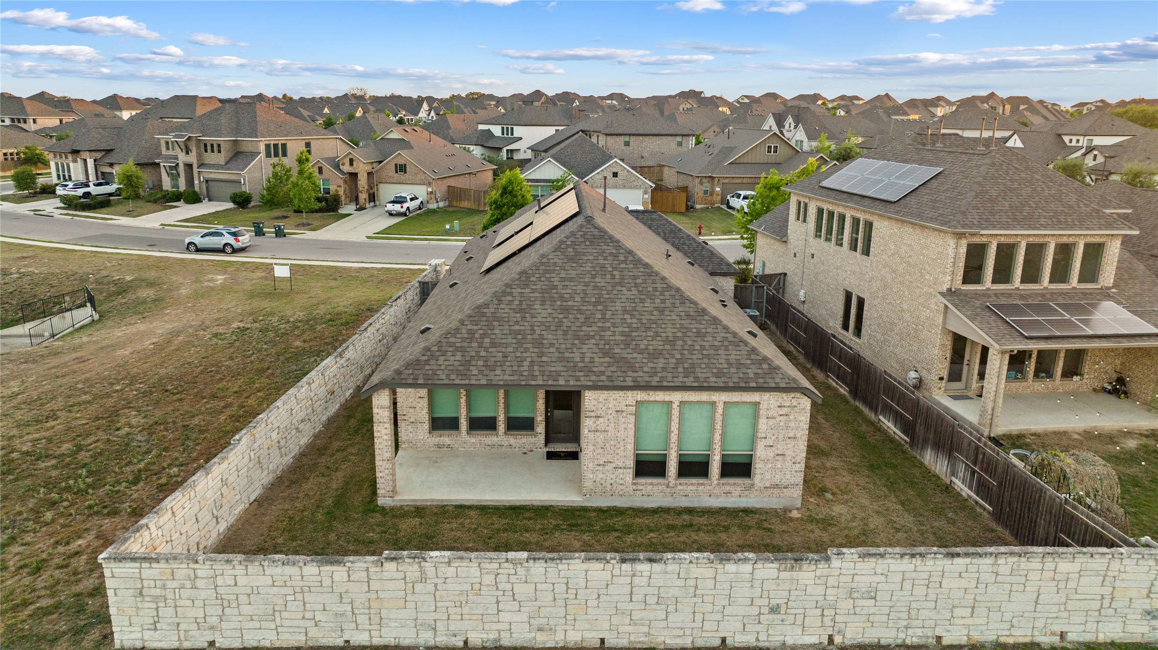 369 Cold Riv Run Kyle, TX 78640 - Photo 34 of 40 The back of the property features a fully fenced backyard and a covered patio.