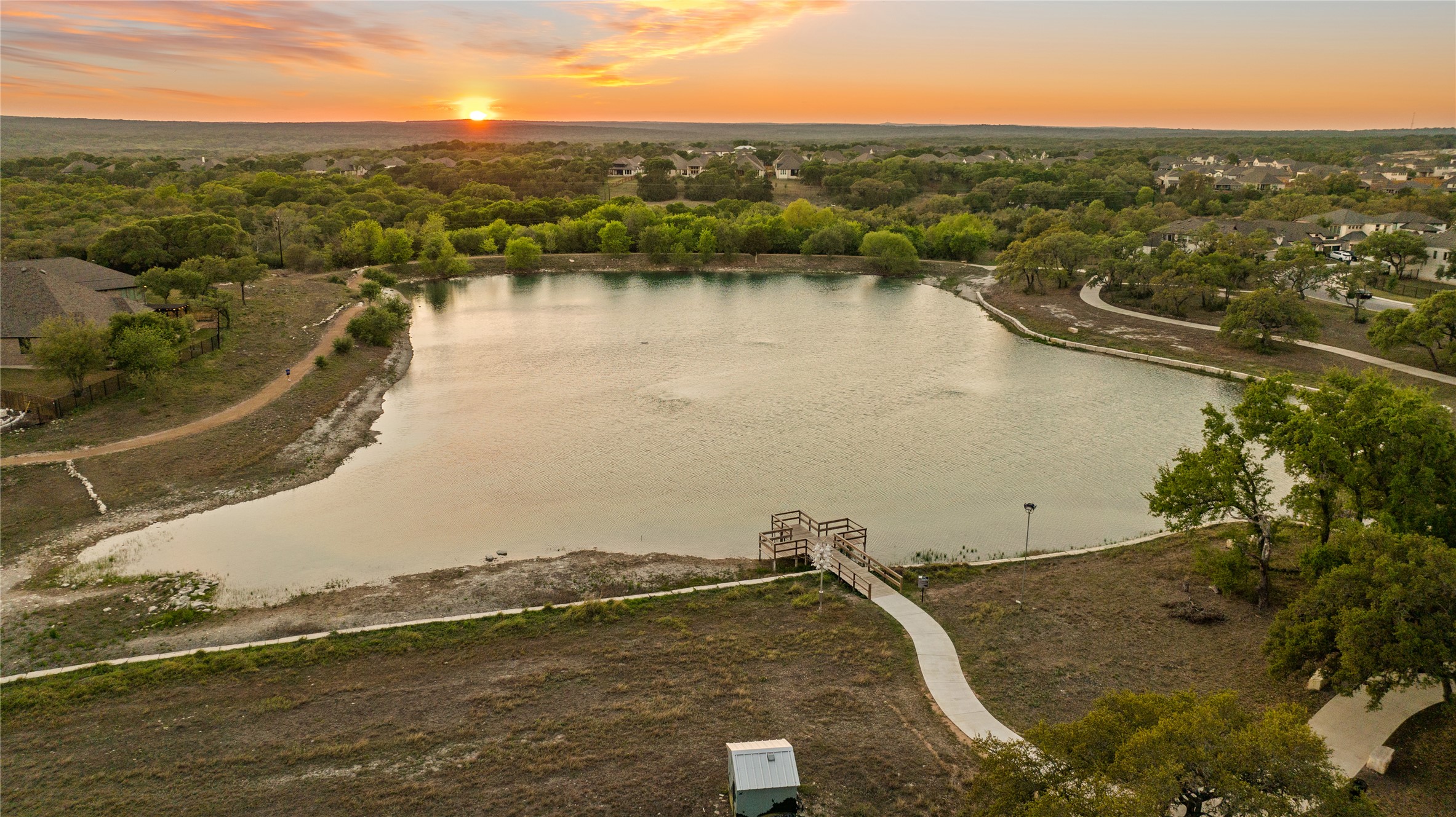 369 Cold Riv Run Kyle, TX 78640 - Photo 36 of 40 Aerial view of the community fishing pond and dock.