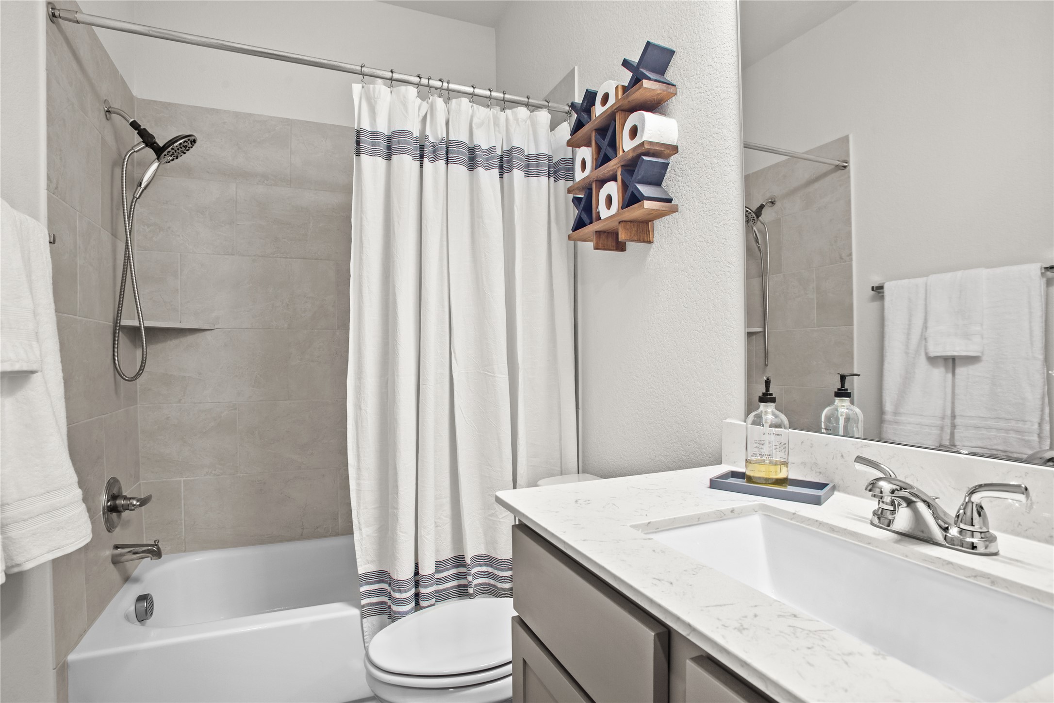 369 Cold Riv Run Kyle, TX 78640 - Photo 8 of 40 Full bathroom featuring vanity, shower / bath combo.