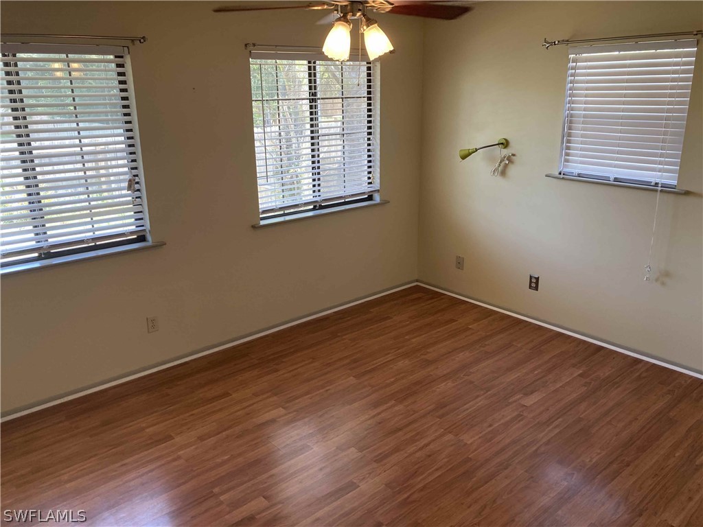 8429 Cardinal Road Fort Myers, FL 33967 - Photo 9 of 16 a view of a room with wooden floor and windows