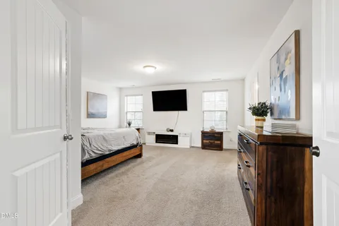 a view of living room with furniture and flat screen tv