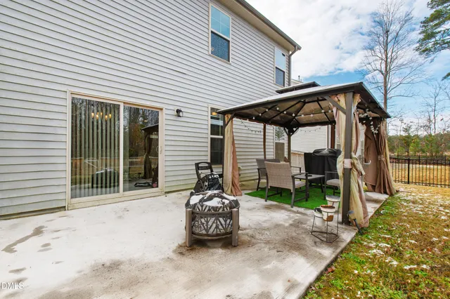 a view of backyard with large trees