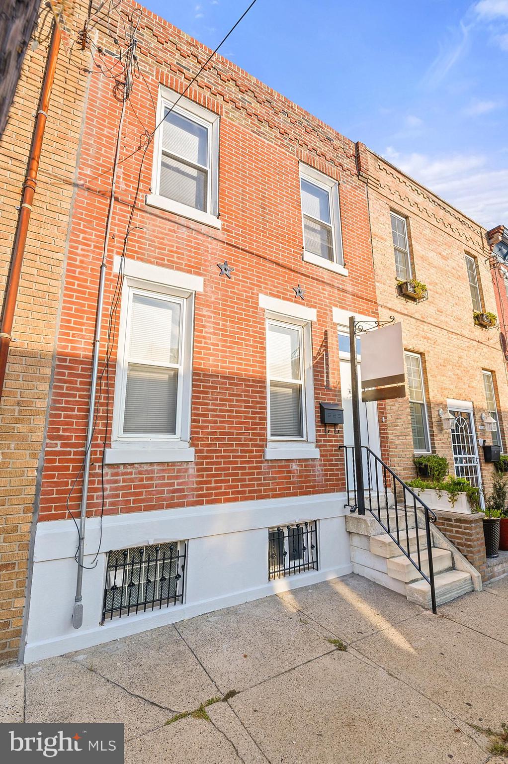 a view of a brick building with many windows