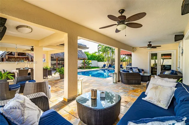 a view of a backyard with sitting area