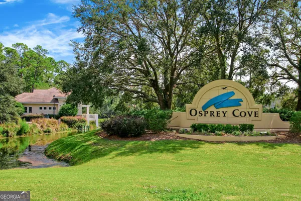 a view of a park that has a sign board