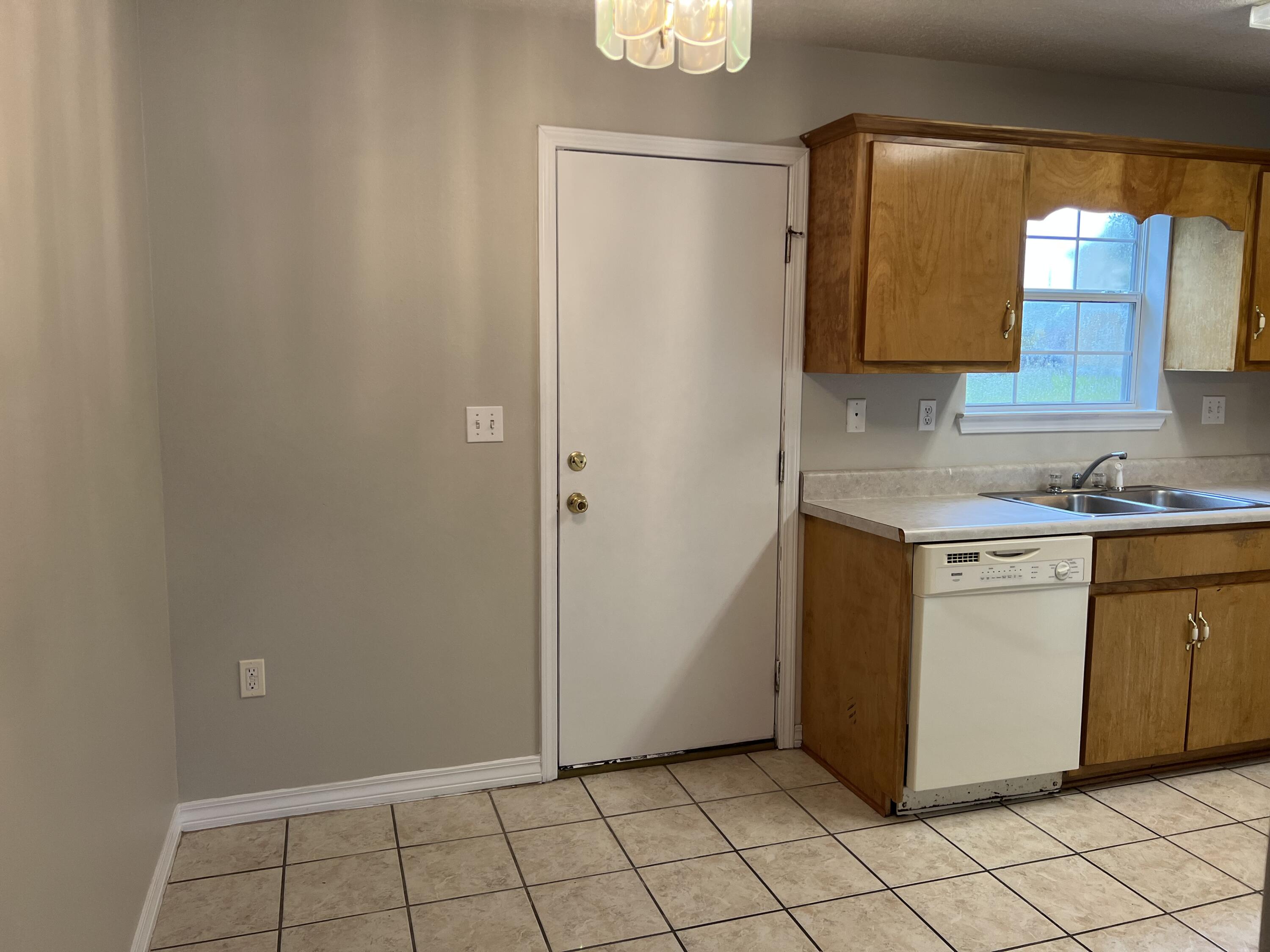 224 Runnymeade Drive Crestview, FL 32539 - Photo 3 of 11 a kitchen with a sink cabinets and window