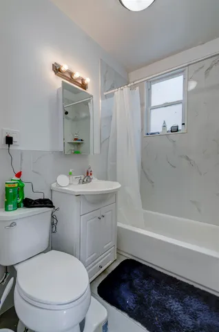 a view of a house with wooden fence