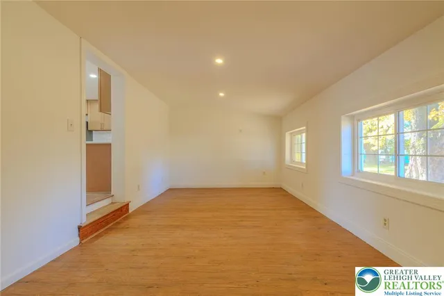a view of an empty room with a window