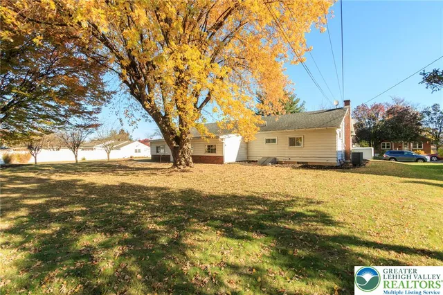a view of a large body of water with a house