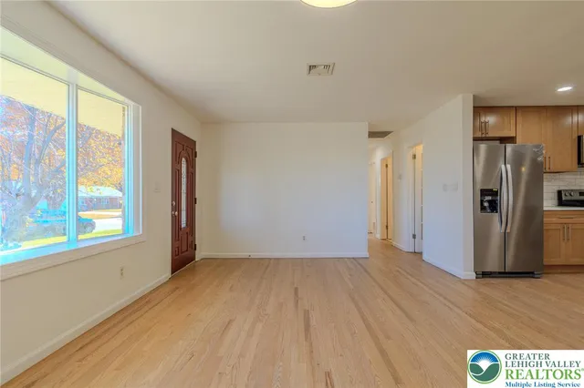 a view of an empty room with a window